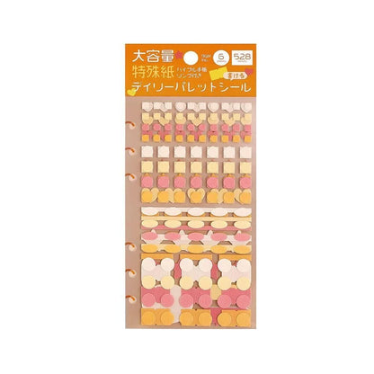 A sheet of Japanese paper stickers by BGM Life in a variety of pastel colors including pink, yellow, orange, and white, arranged in rows on a beige backing card, to be used for journalling or planners. 